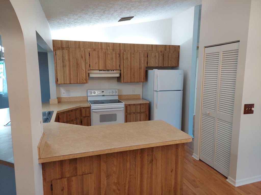 Photo of 2555 SW Monterrey Lane, Port Saint Lucie, FL 34953 (MLS # R10962507)