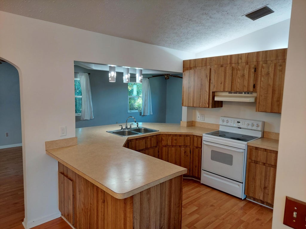 Photo of 2555 SW Monterrey Lane, Port Saint Lucie, FL 34953 (MLS # R10962507)