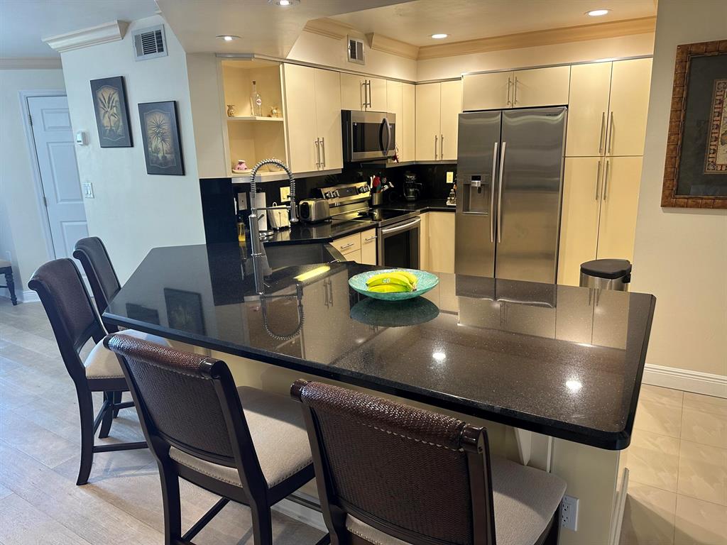 Look no further, gated community on intracoastal with private beach overlooking Hypoluxo island. resort style living. This 3/2 w garage has been updated. . Pet friendly community. Heated / chilled pool, spa ,billiards, clubhouse , sauna, exercise room, lots more amenities. New roof Come join our community. Also located 15 minutes from PBI 10 minutes to major shopping