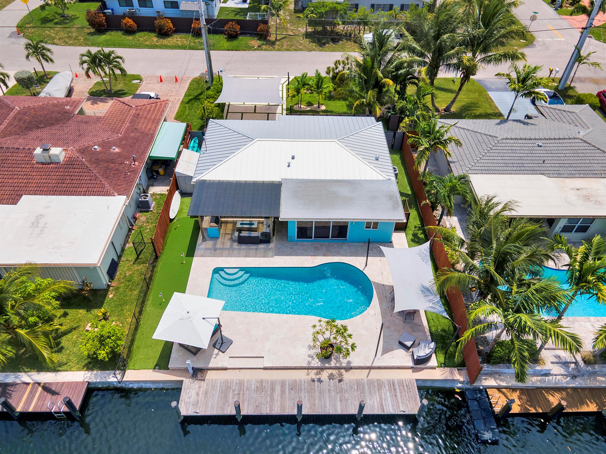 Your winter getaway awaits with your own private dock with direct ocean access! Introducing a stunningly remodeled 3-bedroom, 2-bathroom pool home that offers direct ocean access with no fixed bridges! This exceptional property accommodates a boat of up to 60 feet, making it a perfect choice for boating enthusiasts. Inside, you'll be captivated by the contemporary finishes that enhance both the interior and exterior of your new residence.The home features custom Brazilian oak cabinetry, a Bosch gas stove, and high-quality stainless-steel appliances, ensuring a modern and functional kitchen. The designer lighting and beautifully remodeled bathrooms add a touch of elegance, making this home truly move-in ready. Soak up the sun in your private oasis backyard with a new custom pool.