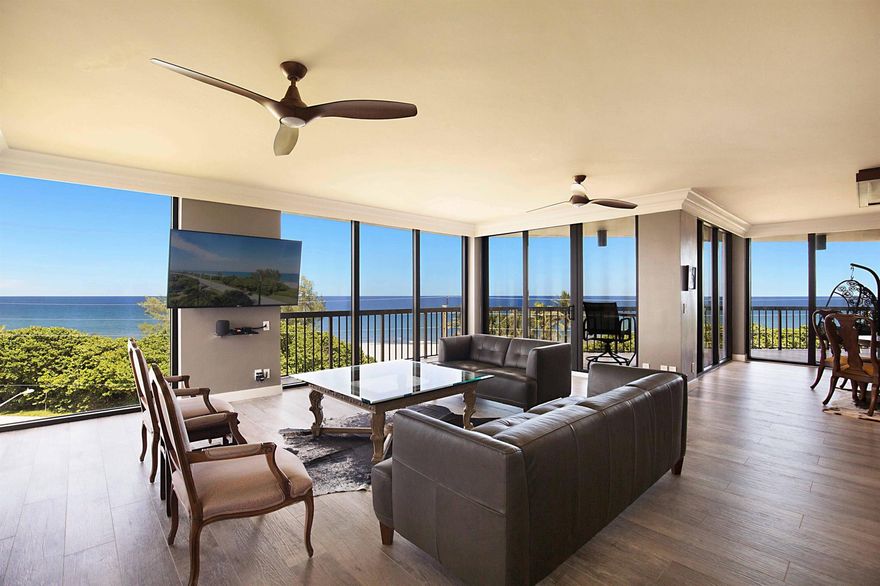 This is a RARE opportunity to rent a half-floor residence with unmatched panoramic ocean views in the exclusive, boutique building of The Ocean Club in Boca Raton. Owning 300 feet of private beach and with only 2 units per floor, 15 total units in the building, The Ocean Club is coveted and exceptionally desirable. This spacious, open, light and bright, 3 bedroom/3 bath condo has been beautifully remodeled and converted to a 2 bed/2.5 bath + expanded living area, which can easily be converted back to a 3 bedroom should renter desire. With 2,490 sf of living space, an open split bedroom floorplan, black marble and driftwood porcelain flooring, an abundance of floor-to ceiling impact windows and doors, and 3 separate balconies (one screen enclosed) off of the large living areas and