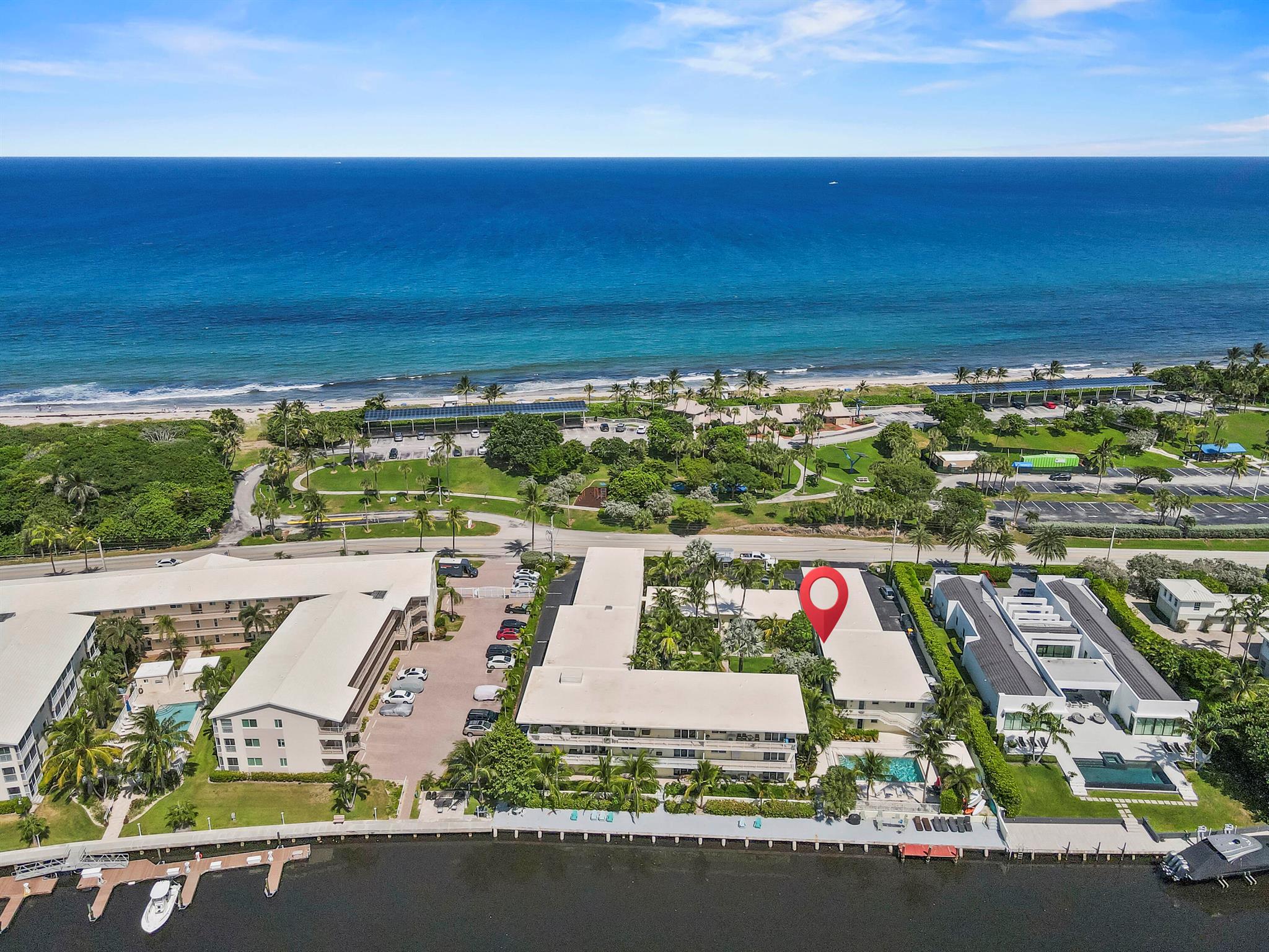 Experience the ultimate beach feel in this fully renovated 2-bedroom, 1-bath condo, perfectly situated for an idyllic coastal lifestyle. Nestled directly across the street from the beach and backing up to a serene Intracoastal Waterway lagoon, this home offers the best of both worlds. The combined living, dining, and kitchen areas create an open and airy atmosphere, with a sliding door providing seamless access to your private patio--the perfect spot to enjoy your morning coffee while taking in the stunning, tranquil sunsets. Convenience is key, with a laundry area neatly tucked inside the unit.