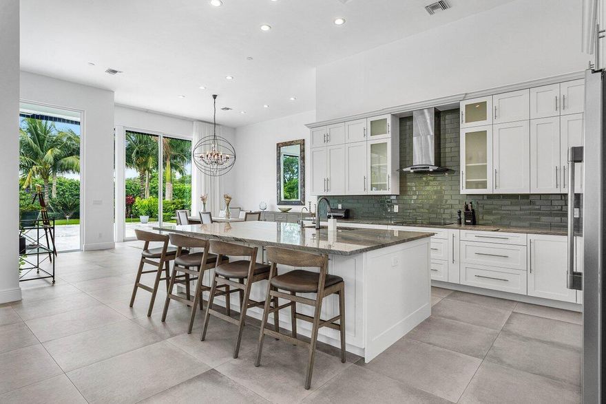 Spectacular! Impeccably renovated: high end luxury with clean neutral tones. Impact windows & doors, 20' ceilings & windows! One level. Spacious new chefs kitchen with extra large fridge, induction stove, huge island. Separate office (could be 4th BEDROOM) Split bedrooms all ensuite, open concept for entertaining & easy living. Gorgeous backyard (almost HALF ACRE), saltwater heated pool with sun shelf, & lush, manicured landscaping.  Relax on the covered & open patios, or the private sitting area with retractable screens.  New full house generator. Bocaire mandatory membership - 239 homes boasts resort style amenities, new clubhouse, championship golf course, tennis, pickle ball, 24 hr fitness, high end dining, friendly & active community. A rated schools, close to beach & restaurants.