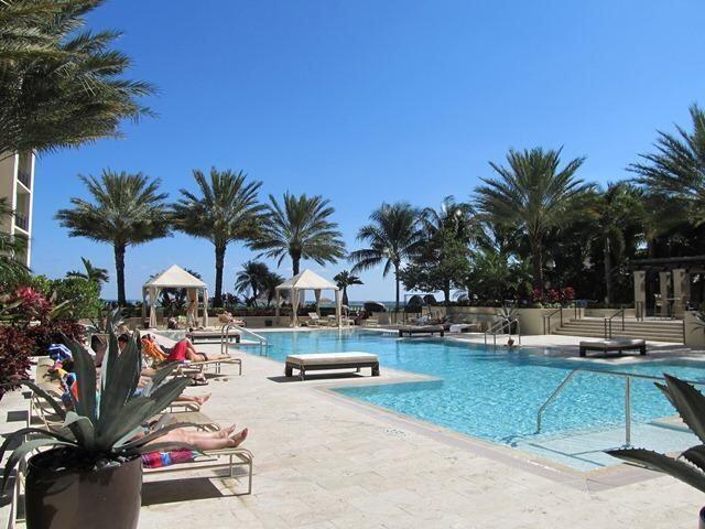 Awesome 2 bedroom plus DEN with 2 PARKING SPACES condo in most desirable building in downtown West Palm Beach. Very large living/dining room area, ceramic tile floor throughout, very large terrace great for gardening, entertaining, or just simply relaxing. 24-hr concierge and security, valet parking, state of the art gym, massage room, beautifully landscaped pool on the 9th floor, sauna, steam bath. Wi-fi and cable are included.