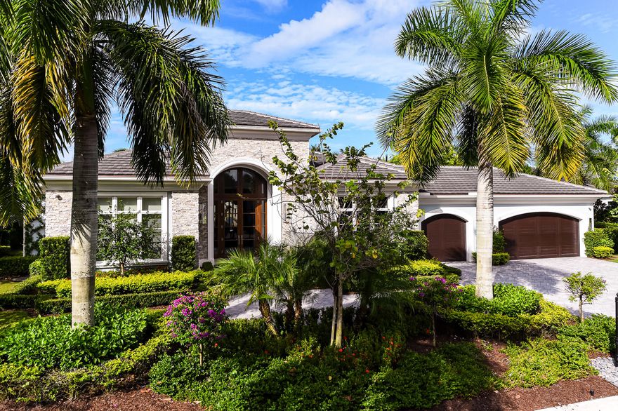 Stunning contemporary 4BR/5.1BA home located in the beautiful Old Palm Golf Club. Built in 2016 by Courchene Development, this gorgeous home features library with built-ins, formal dining room, and gourmet chef's eat-in kitchen. Grand foyer opens to formal living room with high ceilings, wet-bar, and built-in wine cellar. Gracious master suite with private entrance to the pool. Master bath features dual vanities, tub with serene waterfall backdrop, and private outdoor loggia with shower. Seamless indoor/outdoor transition with formal living room leading to screened in loggia with summer kitchen and built-in grill. Beautifully manicured grounds surround large pool and spa. Additional highlights include stunning details and flooring throughout, 3-car garage, impact doors and windows, and