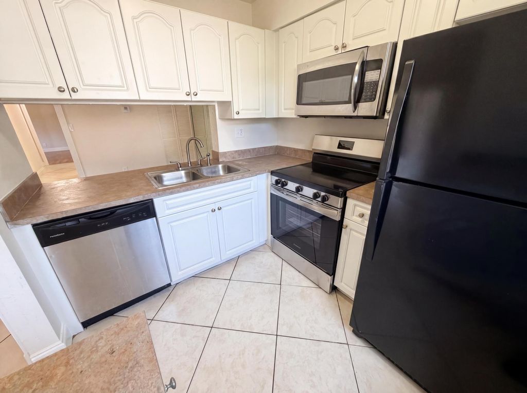 Photo of 2737 S Oakland Forest DR #202, Oakland Park, FL 33309 (MLS # B26031047)