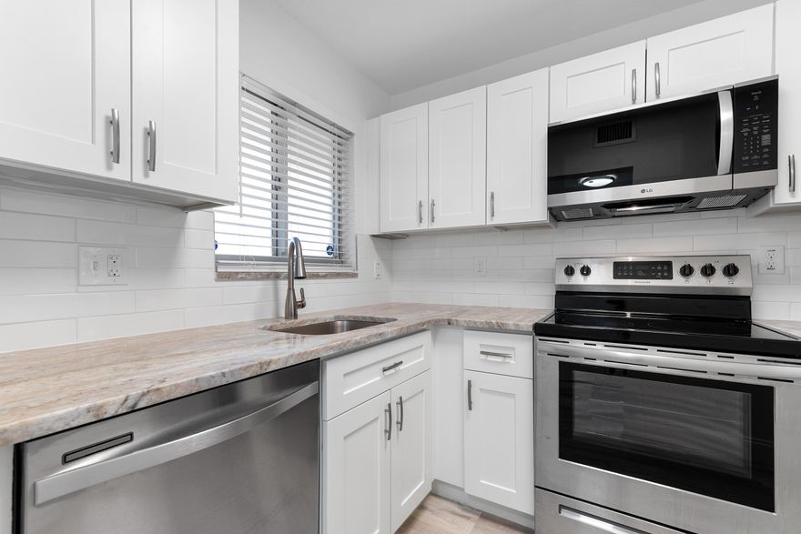 Fully renovated 2BR/2BA condo in Sunrise Lakes Phase 1, a 55+ community. This ground-floor, corner unit feels like a single-family home with the ease of condo living. Renovations completed with permits—new electrical, kitchen, bathrooms, flooring, paint, and more. No expense spared! Enjoy your morning coffee on the walkout screened-in patio or take advantage of community amenities. Maintenance-free lifestyle in a vibrant, active adult community. Schedule your private showing today! This property qualifies for a mortgage rate buydown of up to 3%!