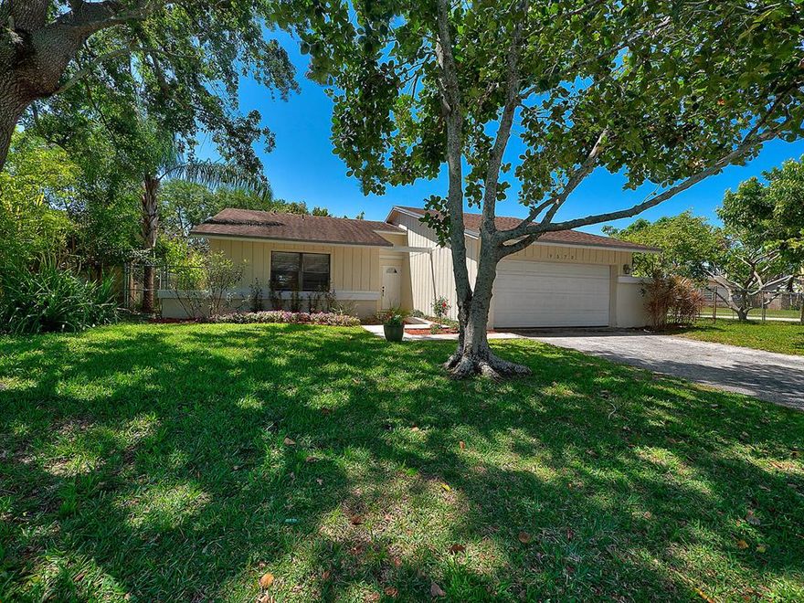 A home which embodies warmth and charm is hard to find, so look no further!  Located on a big corner lot of Saddlebrook in West Boca Raton, this 3 bedroom/2 bathroom home offers tile floors throughout, and brand new wood laminate flooring in the master bedroom.  The kitchen is updated with shaker-style kitchen cabinets in a beautiful cumin color, complementing the countertops.  Both bathrooms are tiled.  One of which includes a shower with modern glass doors.  The air conditioning unit and water heater are less than 3 years old.  The kitchen sliders offer access to an outdoor deck and shaded fruit trees.  Be ready to create beautiful memories and relax, while enjoying a plethora of fruit, including mango, jackfruit, lychee and avocado, in the fully fenced in backyard with a playground. Call today for a showing!