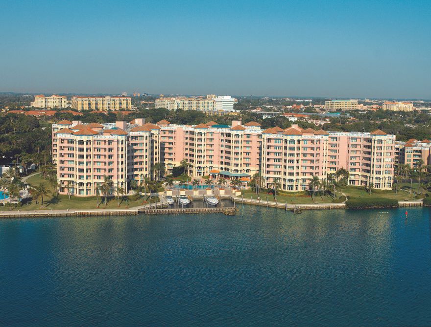 STUNNING COMPLETELY RENOVATED WITH THE FINEST DETAILS THIS RARELY AVAILABLE MIZNER TOWER PENTHOUSE WITH SOARING CEILINGS AND JAW DROPPING INTRACOASTAL TO GOLF COURSE AND CITY VIEWS IS AVAILABLE DESIGNER FURNISHED FOR YOUR IMMEDIATE ENJOYMENT! COMPLETELY UPDATED IN THE FINEST SOFT CONTEMPORARY FINISHES INCLUDING GOURMET KITCHEN, OUTSTANDING BATHS AND LIGHT AND BRIGHT VIEWS THAT WRAP AROUND THIS SPACIOUS CORNER PENTHOUSE RESIDENCE. OFFERED COMPLETELY FURNISHED AND WITH SPLIT BEDROOMS, SUMPTUOUS MASTER SUITE WITH STUNNING HIS AND HER BATHS AND WATER VIEWS, DOUBLE WALK IN CLOSETS AND DETAILED CEILINGS. PEAKED CEILINGS THAT ARE NEARLY 20 FEET WITH WRAPAROUND BALCONY INCLUDING INTRACOASTAL TO OCEAN VIEWS. FULL SERVICE VALET, CONCIERGE BUILDING ON THE GATED GROUNDS OF THE BOCA RESORT AND CLUB.