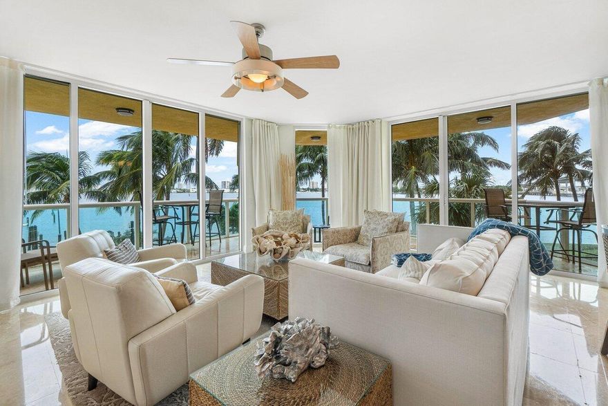 Largest Floorplan in MG! End unit wrap around balcony w/panoramic Intracoastal views! Available June 8, seasonal rate applies for Jan 2027, includes electric <$150/mo. Immaculate 3BR/3.5BA/ with den -condo w/impact glass, Open concept w/spacious great room, den/bonus room, granite kitchen w/stainless appliance & stone backsplash. Split floor plan. Spacious owner suite w/walk-in closet. Spacious owner bath w/double vanity, jetted whirlpool bathtub & water closet.. Neutral paint and marble flooring throughout. 24/7 manned gate, valet, tennis, pickleball, walking path w/gazebo, covered rooftop oasis w/pool, spa, BBQ areas, clubhouse, billiard room & fitness center. Marina w/dry docks available. Jump on your boat effortlessly & be on the ocean in minutes; no fixed bridges!