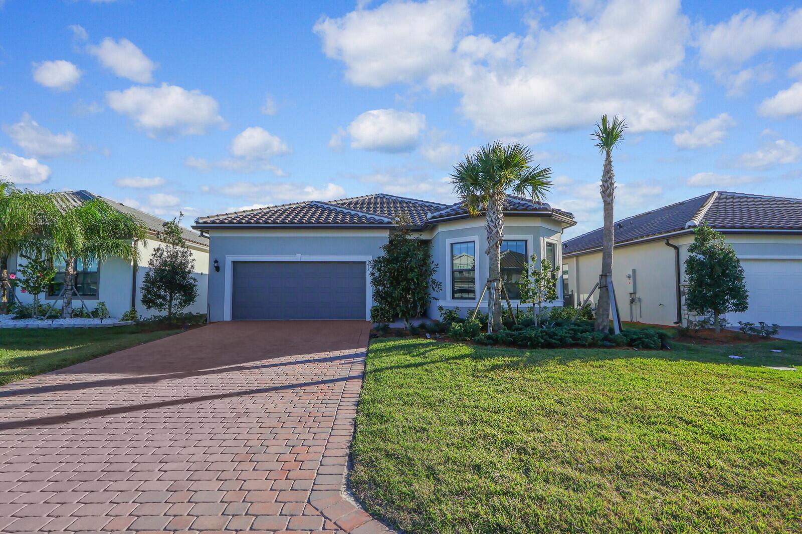 Located in the gated community of Veranda Gardens, this meticulously upgraded home offers over $80K in builder upgrades & $20k in owner upgrades. Enjoy open-concept living with 10'8'' ceilings, oversized crown molding throughout, 8' interior doors, wood-look ceramic tile, & a decorative glass insert front door. Chef's kitchen boasts quartz countertops, 5-burner gas cooktop, wall & convection oven, walk-in pantry, & 11' island. Primary suite features tray ceiling, custom lighting, & super spa shower. Relax in the extended screened-in lanai overlooking a fully fenced yard. Hurricane impact windows/doors, blown-in insulated attic & garage, epoxy floors (ox floors), mini-split A/C, oversized pull-down attic ladder, generator hookup, & overhead garage storage make this home truly move-in ready