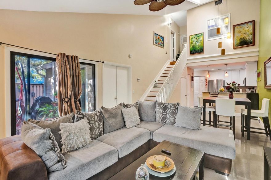 Bright, inviting, and now even more compelling—this 3-bedroom, 2-bathroom corner-lot home offers the perfect blend of space, comfort, and value. Vaulted ceilings and an open, airy layout fill the home with natural light, creating a welcoming atmosphere from the moment you step inside.  The main living area flows seamlessly to a private patio—ideal for relaxing evenings or entertaining guests. Recent upgrades, including a newer roof and A/C, provide peace of mind, while the impact sliding glass doors adds both convenience and protection.  Located in a desirable Players Place community with access to a pool, clubhouse, and more, and just minutes from schools, shopping, dining, and major highways—this home checks all the boxes.