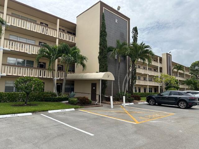 Extremely desirable Wolverton Section -4th floor- 1 bedroom, 1.5 bath - easy access to the elevator and parking space first space to entry. Lite and bright unit with views of 2 lakes from the screened in balcony. Walking distance to houses of worship and Clubhouse. Century Village is like living in a resort, fitness center, live shows, movies, buses, classes, bingo, card rooms, trips, tennis and pickleball. Easy access to shopping and restaurants.