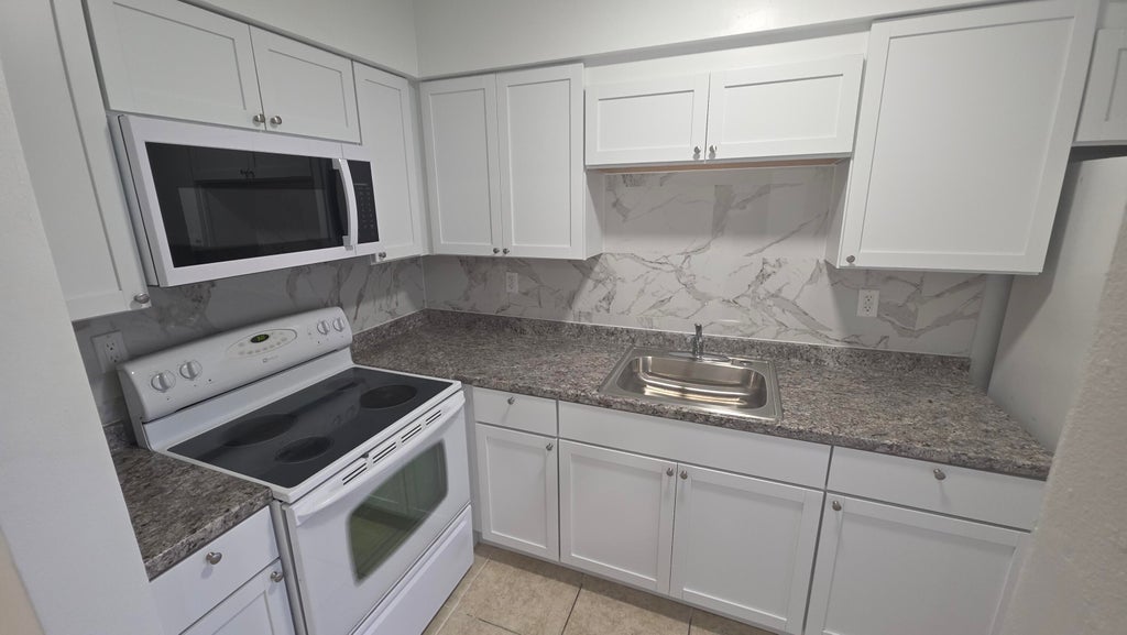 Photo of 7511 VENETIAN Street #4, Miramar, FL 33023 (MLS # B26057110)