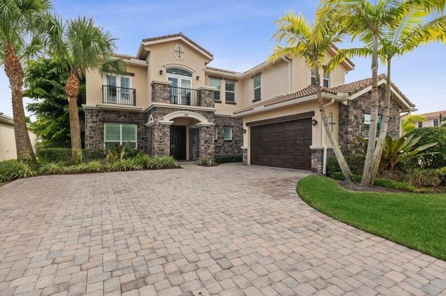 Located on a quiet lot just before the cul de sac, this rare expanded Carina model features golf course views, an expanded kitchen, expanded lanai, expanded summer kitchen, plus his and her master bathrooms.  Current owner updates include: new kitchen cabinets, appliances, quartz countertops, amazing butler's pantry/bar with a wine cooler and beverage refrigerator, new premium Duchateau wood floors, tiled outdoor patio kitchen, remote screens and more.  Jupiter Country Club features stunning resort amenities, including a Greg Norman golf course, tennis courts, pickle ball courts and fitness center. Option to purchase an associate golf membership is available with this home.