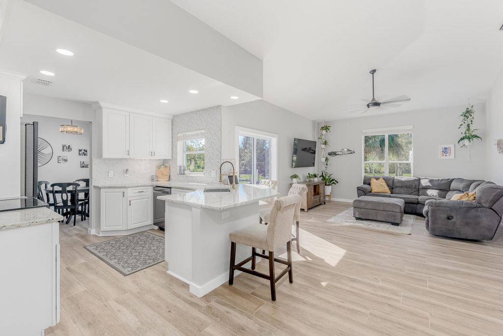 Photo of 6104 SW Woodham Street, Palm City, FL 34990 (MLS # R10968221)