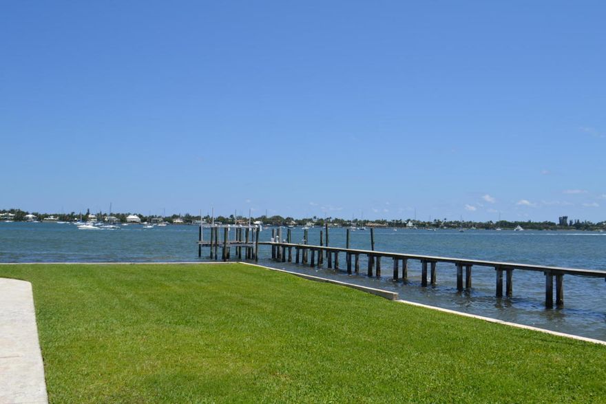 Old Florida Charm with with spectacular direct Intracoastal views! Relaxed, hassle free, waterfront living at the end of a secluded road off North Flagler Drive. This paradise property is tucked away on a private peninsula between the Flotilla Club (private yacht club) and the Palm Beach Sailing Club. Featuring solid CBS construction, hurricane impact windows and crown molding. This 2 bedroom/2 bath condo was completely renovated in March 2016 with fresh paint throughout, brand new kitchen cabinets, marble counter tops, tile flooring and appliances including a new stackable washer/drying. Master bedroom has new engineered flooring and completely renovated master bath with marble throughout. Both the Flotilla Club and Palm Beach Sailing Club have docking available for your boat