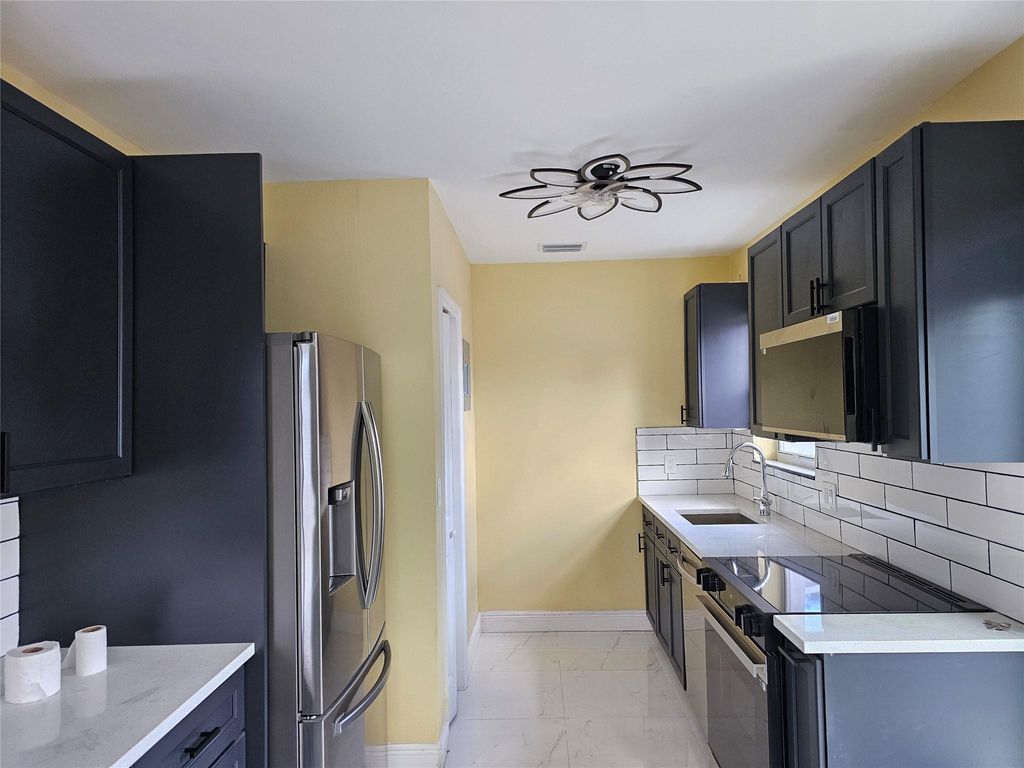 Photo of 1152 NW 17th Ave, Fort Lauderdale, FL 33311 (MLS # F10493292)