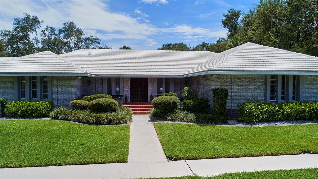 A premier single story estate situated on an expansive park-like 1.15 Acre lot with majestic oak trees in Palm Beach Farms. This unique home stretches over two lots (.576 Acre) plus an additional two lots totaling (.576 Acre) used as the private tropical oasis backyard. The sprawling home boasts five bedrooms, four and a half bathrooms, w/ a family/billiard room, separate office, and fireplace Florida room, three car garage, saltwater pool & screened patio. granite, wood,& tile flooring throughout living areas. The two rear lots are a natural beauty. Great Public Schools, Close to Downtown Boca & Beaches, Information contained herein is deemed reliable but not guaranteed, Buyer to verify all information and measurements, No RE commissions paid unless successful title passes. See Supplement