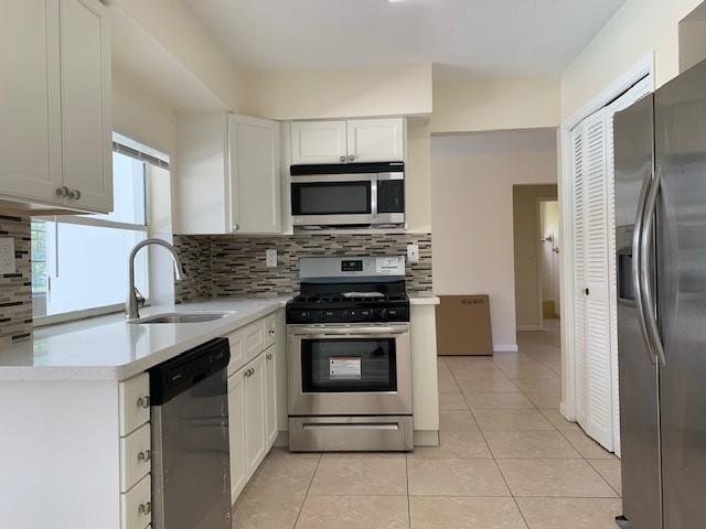 Cozy 3/2 pool home in Sunrise Golf Village! lots of windows make it a bright, screened pool with a nice-sized yard, one-car garage, and Tile Flooring.
