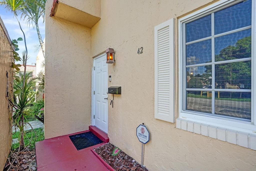 Photo of 42 Canterbury Lane, Tamarac, FL 33319 (MLS # F10529011)