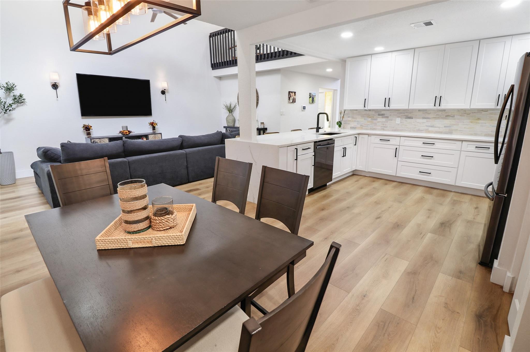 ABSOLUTELY STUNNING! Step into this beautifully fully renovated townhouse where style meets substance. Featuring a tongue & groove ceiling that adds warmth and character, this home is packed with thoughtful updates that make it truly move-in ready. Major upgrades include a new roof (2017), tankless water heater, and a high-efficiency AC unit (2020) for year-round comfort and peace of mind. Every corner of this home has been carefully updated to offer a modern living experience while maintaining timeless charm. Also offering a full sized coffee/Dry bar just off the kitchen this home, a low hoa, quick approval process , and walking distance to the pool this home truly has it all. Whether you're a first-time buyer, downsizing, or looking for a turnkey investment, this property is a standout.
