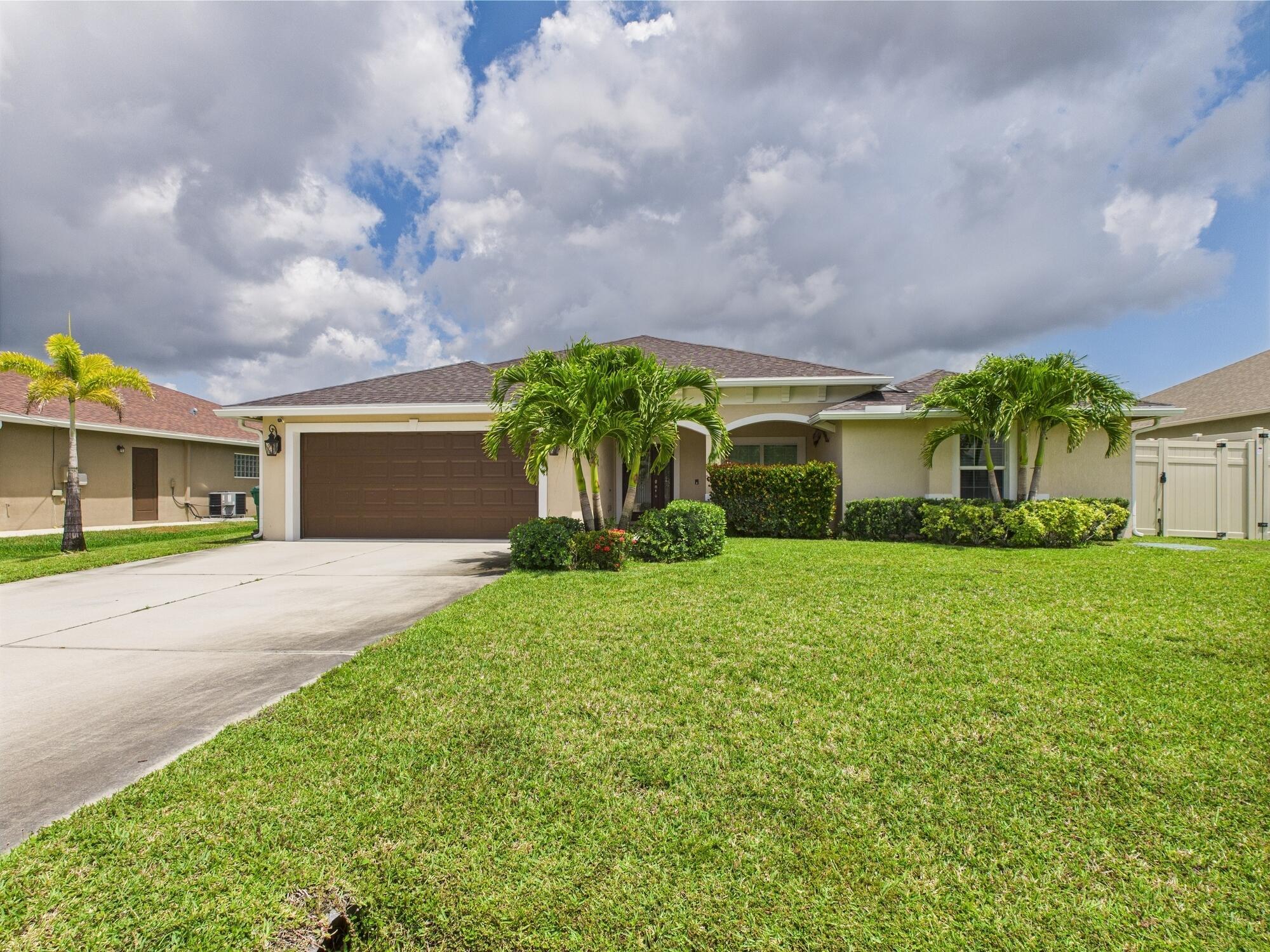 Step into the perfect blend of cozy design and modern convenience in this newer construction 4BD/2BA home. Featuring a split floor plan and open-concept living, this home showcases tongue-and-groove ceilings, tile floors, and a warm rustic-inspired feel. The kitchen boasts granite countertops, dark cabinetry, and plenty of space to gather. The spacious master suite offers tray ceilings, a large walk-in closet, a luxurious en suite with dual vanities, a soaking tub, a walk-in shower, and a private water closet. Enjoy outdoor living on the 10x17' front porch or the 10x28' screened back porch with a stone lanai. Set on a beautifully landscaped lot with an 8' privacy fence, a majestic oak in the back, and a shed for your tools.