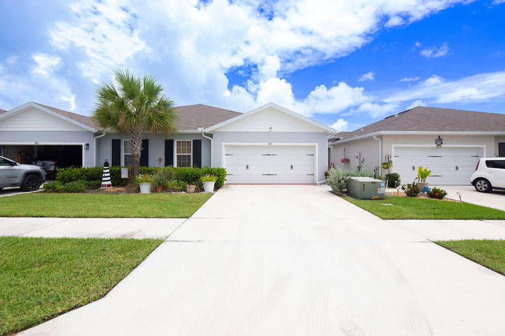 Photo of 818 Persimmon Place, Fort Pierce, FL 34981 (MLS # B26071535)