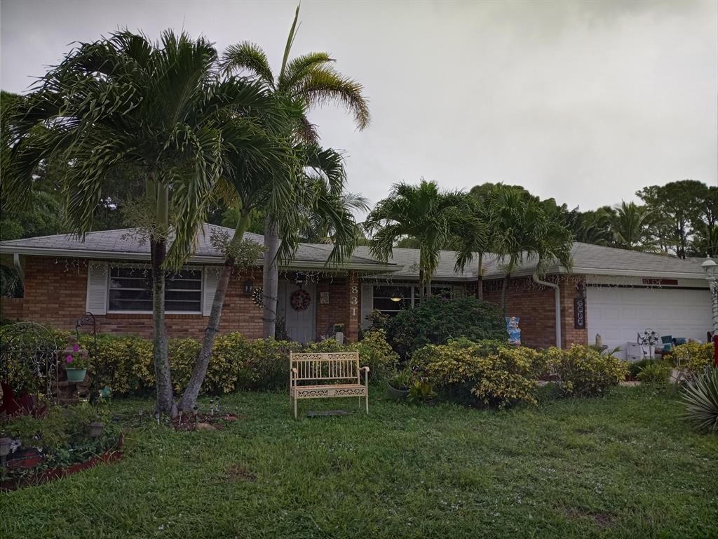 Photo of 831 SE Polynesian Avenue, Port Saint Lucie, FL 34983 (MLS # R10741730)
