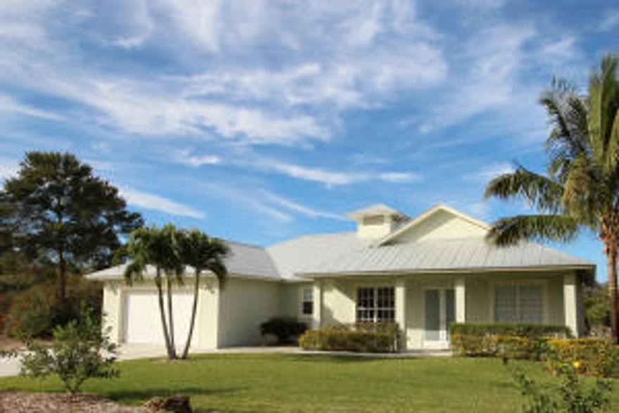 You do not want to miss the opportunity to see this fabulous Key West style home. Newly constructed in 2009 with the highest quality standards. This is a 3 bedroom, 2 bath split floor plan with wide open and airy living space. Impact glass, quality kitchen cabinetry with granite countertops, and tile throughout the home. Two sets of sliding glass doors open up to a large covered patio then onward towards an oasis of tropical beauty and relaxation. Located on a half acre of property so you can enjoy your privacy. Call today for a private showing!