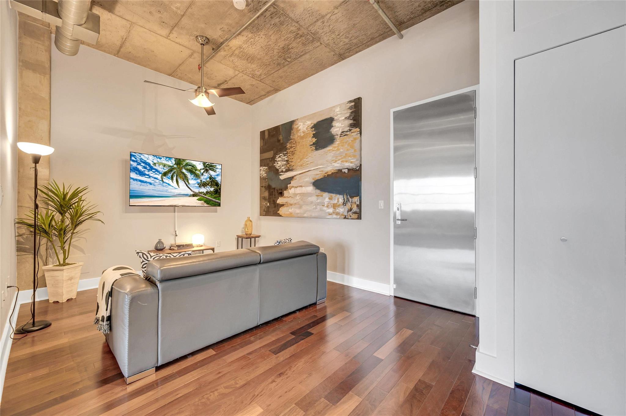 REDUCED FOR IMMEDIATE SALE -New York Style Industrial Loft - . Second sleeping space offers flexibility or customization as bedroom, office or den. covered parking space. In the heart of HOT and fast changing FLAGLER VILLAGE, 1 block to the Brightline high-speed train station from Miami to Orlando. On-street parking through the Flagler Village Resident Parking Program.