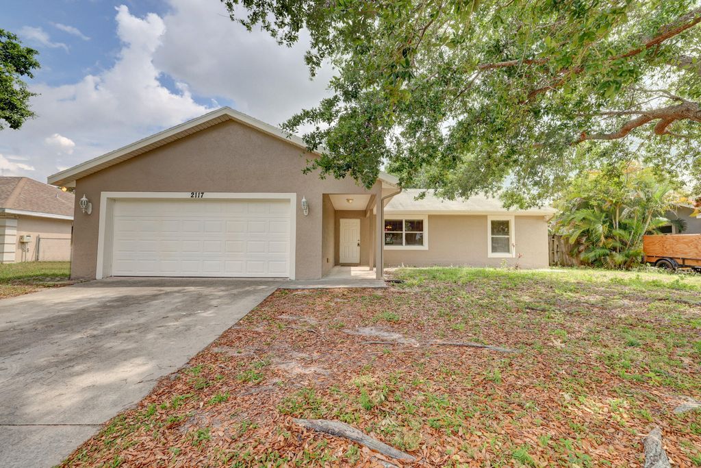 Photo of 2117 SW Susset Lane, Port Saint Lucie, FL 34953 (MLS # R10789047)