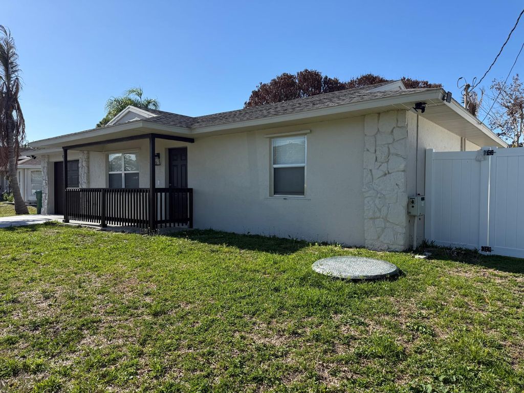 Photo of 699 NW Riverside Drive, Port Saint Lucie, FL 34983 (MLS # B26018516)