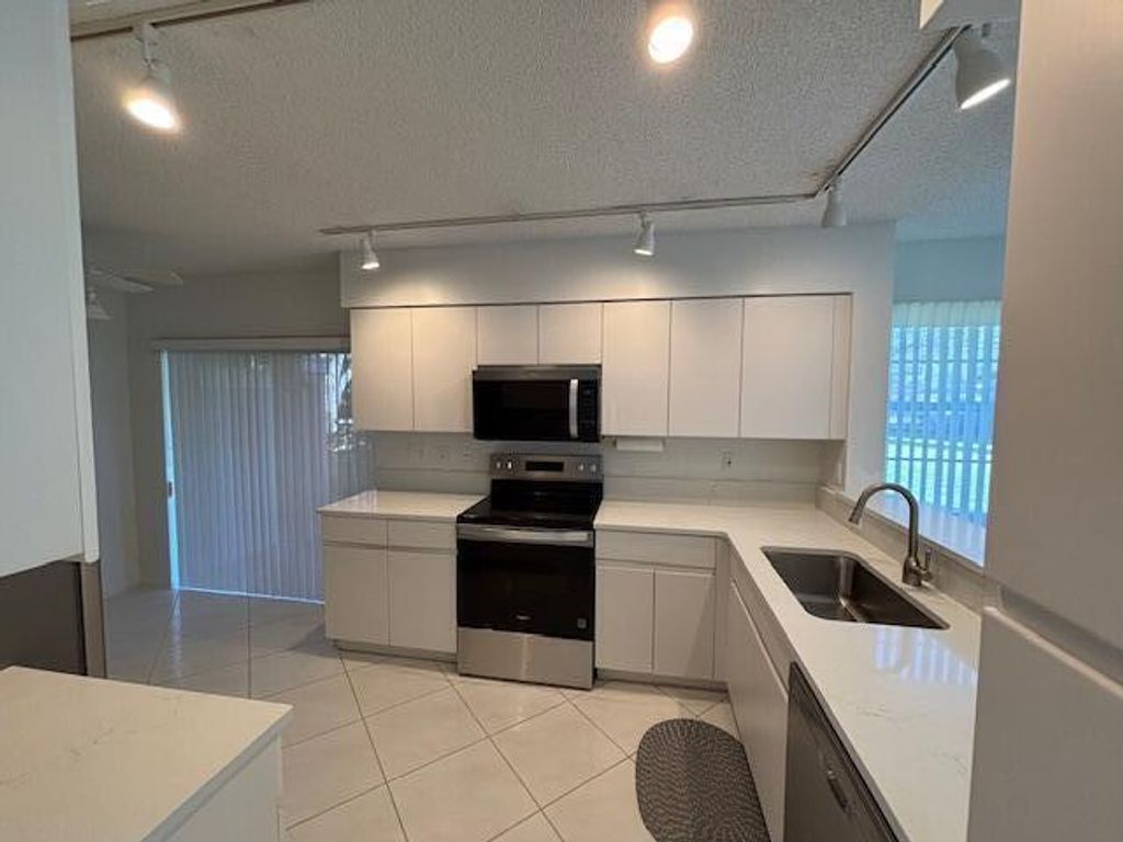 Photo of 7372 Lake Meadow Way #101, Boynton Beach, FL 33437 (MLS # R11151597)