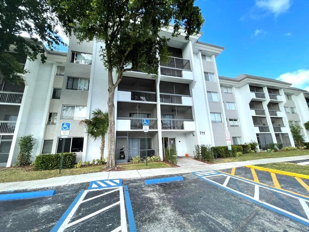 Photo of 711 N PINE ISLAND Road #305, Plantation, FL 33324 (MLS # B26057311)