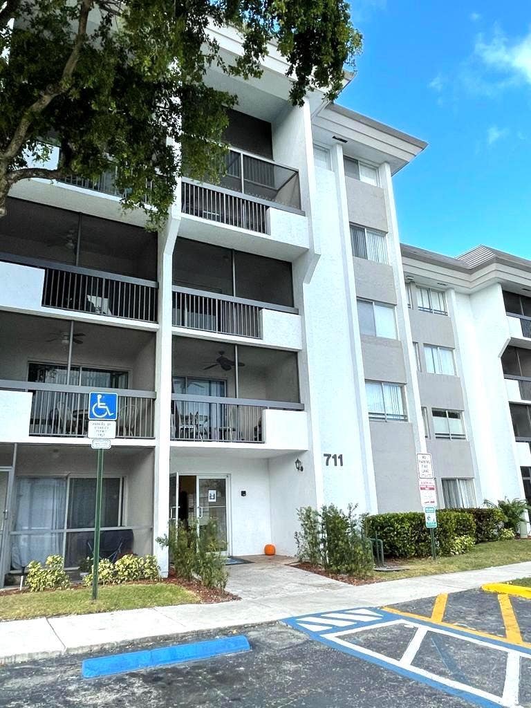 Photo of 711 N PINE ISLAND Road #305, Plantation, FL 33324 (MLS # B26057311)