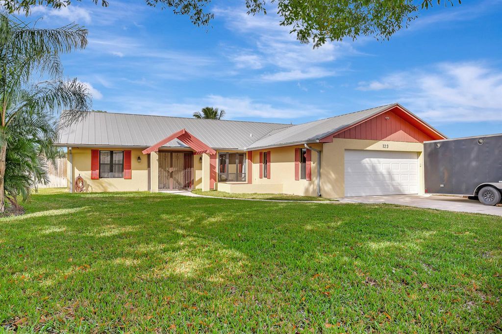 Photo of 123 NE Caprona Avenue, Port Saint Lucie, FL 34983 (MLS # R10941601)