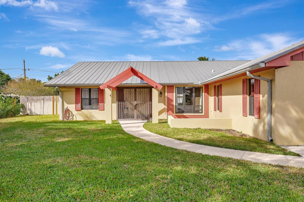 Photo of 123 NE Caprona Avenue, Port Saint Lucie, FL 34983 (MLS # R10941601)