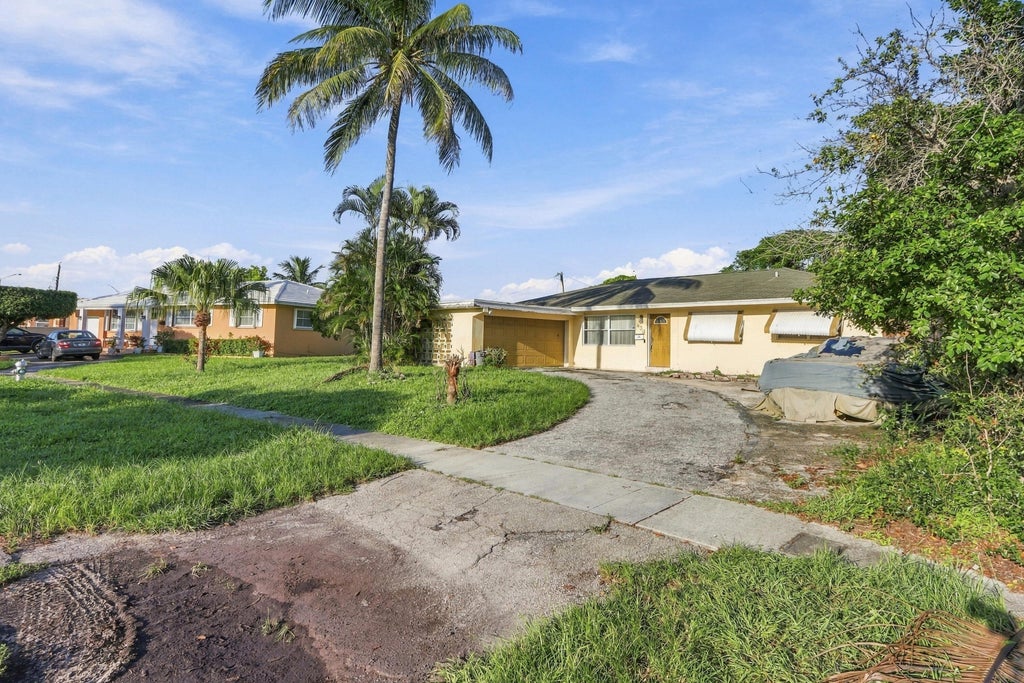 Photo of 430 N Ware Drive, West Palm Beach, FL 33409 (MLS # B26076392)