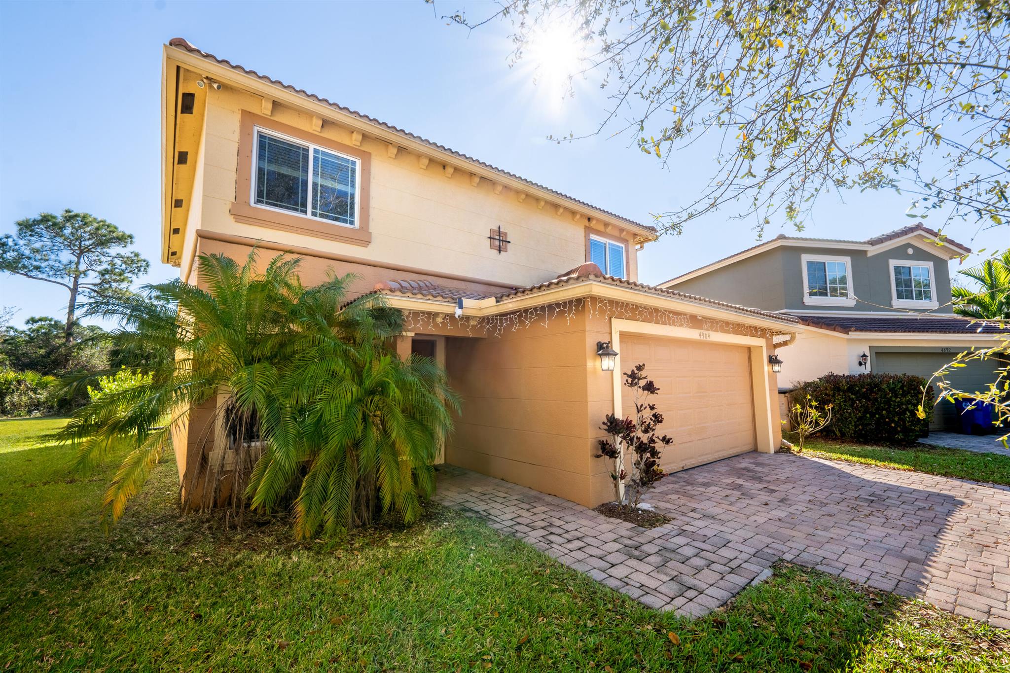 Welcome to 4904 SE Duval Drive, a beautiful 3-bedroom, 2.5-bathroom, 2-car garage home located in the desirable family-friendly community of Martin Crossings in Stuart. This charming residence offers not only a stylish and upgraded interior but also access to an array of community amenities, making it an ideal place to call home. As you step inside, you'll immediately notice the solid tile floors on the first floor and warmth of the wood floors covering the entire second floor, creating a seamless and inviting atmosphere throughout the home. The interior has been freshly painted, enhancing the light and airy ambiance that fills each room. New kitchen appliances, sink, A/C unit, garage coating, reverse osmosis, luxury vinyl plank flooring on stairs and upstairs.