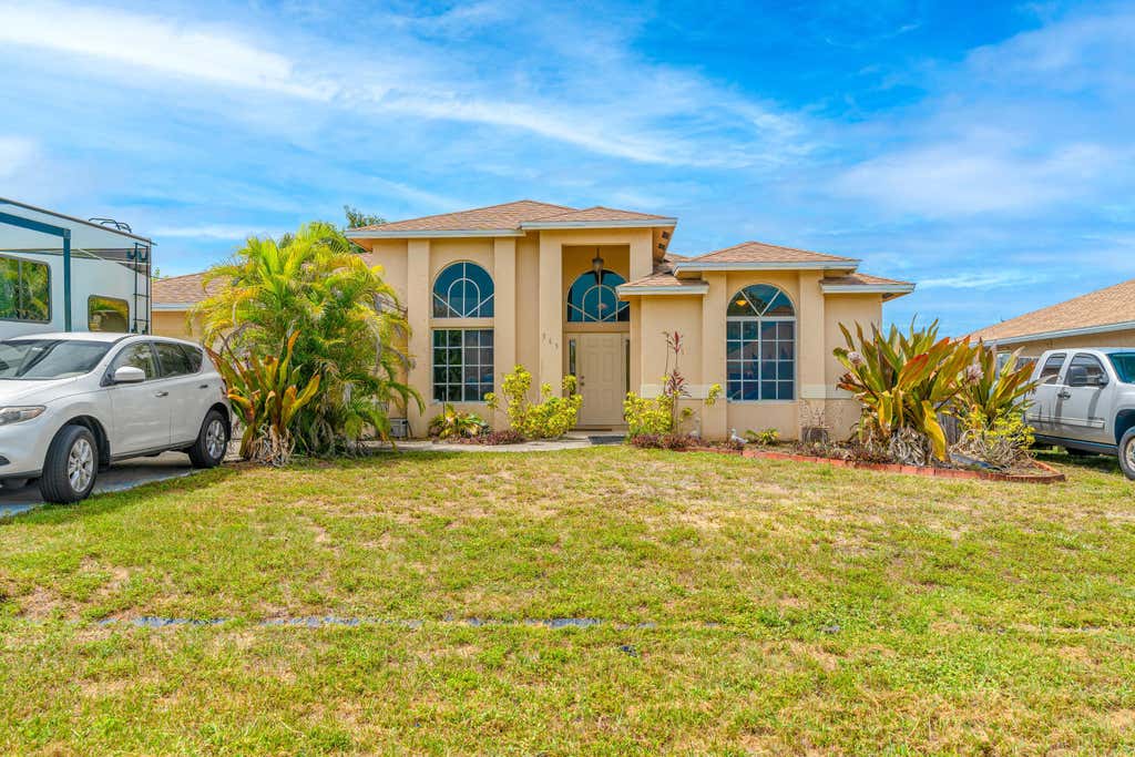 Photo of 565 SW Halkell Avenue, Port Saint Lucie, FL 34953 (MLS # R11003368)