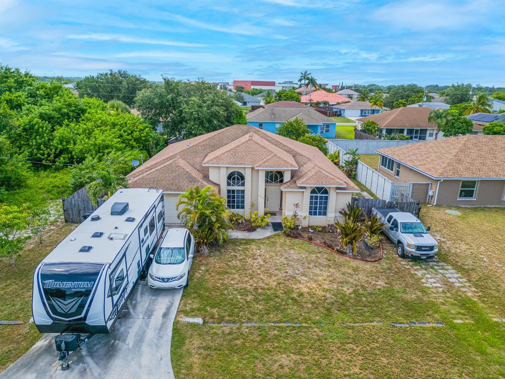 Photo of 565 SW Halkell Avenue, Port Saint Lucie, FL 34953 (MLS # R11003368)