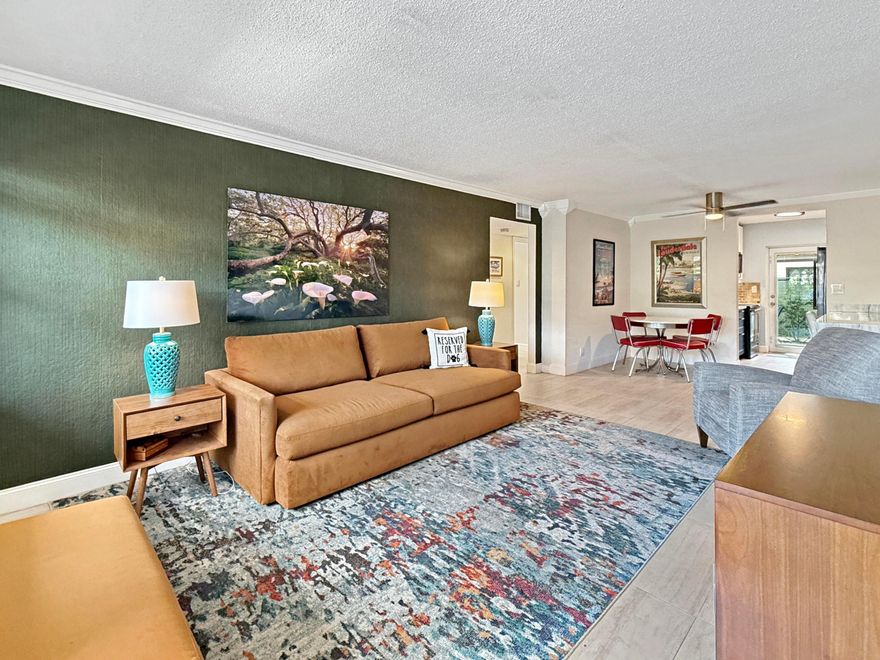 The PERFECT Wilton Manors pied-à-terre: 1st floor furnished END unit, with semi-private back patio with direct pool access PLUS in unit laundry! Only 1.5 blocks to Wilton Drive! This 2 Bed, 1 Bath corner unit is light and bright with extra windows only an end unit can have! The updated two tone galley kitchen features black stainless steel appliances, stainless steel tile backsplash, & under cabinet lighting! Bar area in dining area is perfect for working from home! 2 assigned parking spaces! (One parking space immediately in front).  Additional guest spaces nearby. Investor-friendly complex. The monthly condo fee is $618 & covers: property manager, community pool, common area maintenance, insurance, water/trash/sewer, & reserves. Call today! (all info believed accurate but not warranted).