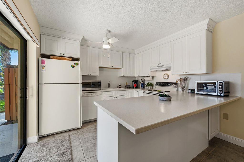 Photo of 5720 SE Windsong Lane #326, Stuart, FL 34997 (MLS # B26001281)