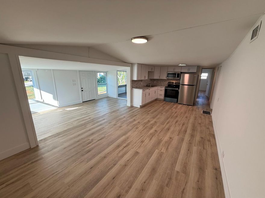 Beautifully renovated 4 bedroom, 2 bathroom home on your own land with no HOA or land lease fees. This move-in ready property is filled with natural light thanks to numerous new windows throughout. Enjoy a fully updated interior with a new roof, new windows, new kitchen, new bathrooms, new flooring, stainless steel appliances, and a brand new central AC unit. Outdoor features include an updated deck and patio perfect for relaxing or entertaining and a fenced yard with an 11x10 storage shed for extra space. Located just 8 miles from beautiful beaches and 10 minutes from downtown Stuart.