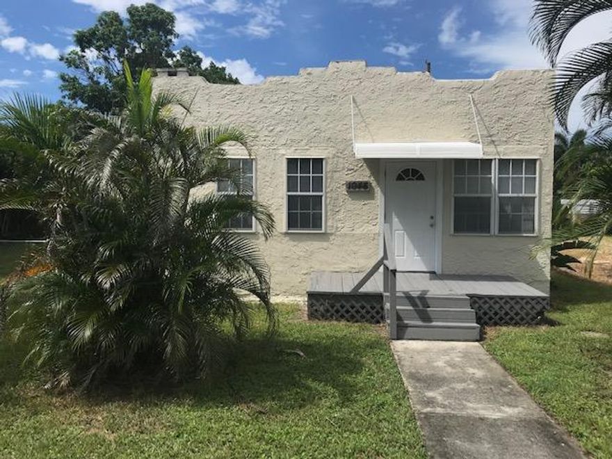 Nicely maintained 4 BR, 2 BA home situated on a double lot next to Dreher Park and within walking distance to the Palm Beach Zoo and Science Museum. The living area is huge and has beautiful hardwood flooring. The kitchen and bathrooms have been updated. The home has lots of potential. Ideal for an investor or owner-occupant. Close to 95, downtown West Palm Beach and all that the surrounding area has to offer.