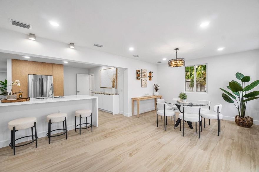 Discover the COASTAL ELEGANCE in this newly RENOVATED 4/3.5/2 home w/ NEW POOL COMING SOON iN the very desirable charming neighborhood of CHAPEL HILL!  Stunning light wood look porcelain Italian tile throughout. The kitchen features contemporary light wood & white cabinets w/ quartz countertops, KITCHEN AID APPLIANCES, 2 pantries w/ pull out drawers, custom built serving station and a peninsula for bar stools.  Each custom designed bathroom is more beautiful than the last, right out of a magazine!  A 22 x 12 sparkling blue POOL w/ SUNSHELF will be installed. Huge fenced backyard, great for entertaining friends!  NEW ROOF 2024  Close enough to take your golf cart to vibrant Atlantic Ave w/ upscale restaurants, art galleries, boutiques, nightlife & 2 miles to the beach!