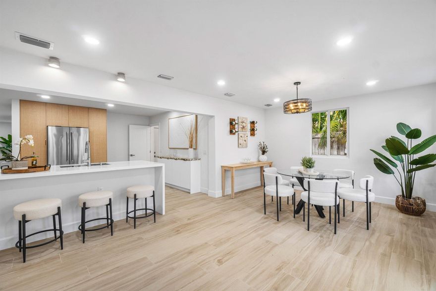 Discover the COASTAL ELEGANCE in this newly RENOVATED 4/3.5/2 home w/ NEW POOL COMING SOON iN the very desirable charming neighborhood of CHAPEL HILL!  Stunning light wood look porcelain Italian tile throughout. The kitchen features contemporary light wood & white cabinets w/ quartz countertops, KITCHEN AID APPLIANCES, 2 pantries w/ pull out drawers, custom built serving station and a peninsula for bar stools.  Each custom designed bathroom is more beautiful than the last, right out of a magazine!  A 22 x 12 sparkling blue POOL w/ SUNSHELF will be installed. Huge fenced backyard, great for entertaining friends & family!  NEW ROOF 2024  Close enough to take your golf cart to vibrant Atlantic Ave w/ upscale restaurants, art galleries, boutiques, nightlife & 2 miles to the beach!