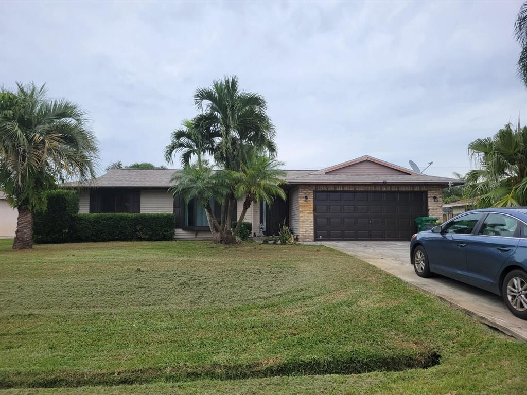 Photo of 617 SW Empire Street, Port Saint Lucie, FL 34983 (MLS # R10756583)