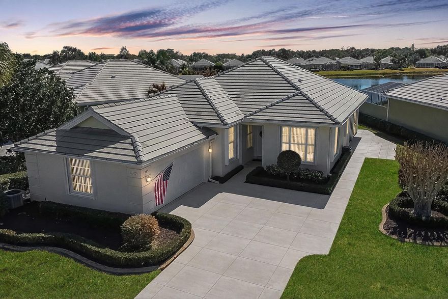 Breathtaking Lake Views & Modern Luxury! Experience peaceful waterfront living in this beautifully updated 3BR+Flex/2.5BA/2CG home in the Lakes at St Lucie West. Elegant plank tile flooring in most areas. The gourmet kitchen features 42'' cabinets, granite counters, stainless appliances, and a convenient breakfast bar. Dual sets of triple sliders lead to a covered, screened patio and an extended wrap-around open paver patio—perfect to enjoy the stunning lake views. Interior highlights include stylish French doors and a spacious primary suite. Fully Replumbed, 2015 A/C, 2019 Water Heater, Accordion Shutters.  HOA fees provide lawn care, cable, 2 community pools.  Located in the heart of St Lucie West.